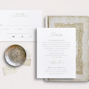 May include: A white RSVP card with a grey border and text that reads "responded by THE FIRST of AUGUST". The card has a section for the guest's name, a checkbox for accepting or declining the invitation, and a section for the number of guests. There are three icons below the checkboxes: a pig, a chicken, and a fork. The card is on a white background.