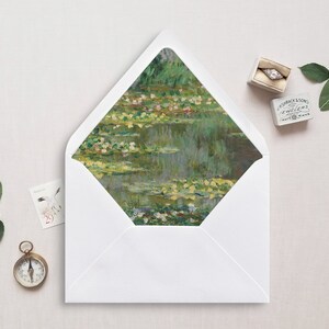 May include: A white envelope with a flap featuring a painting of a pond with water lilies. The painting is in shades of green, blue, and yellow.