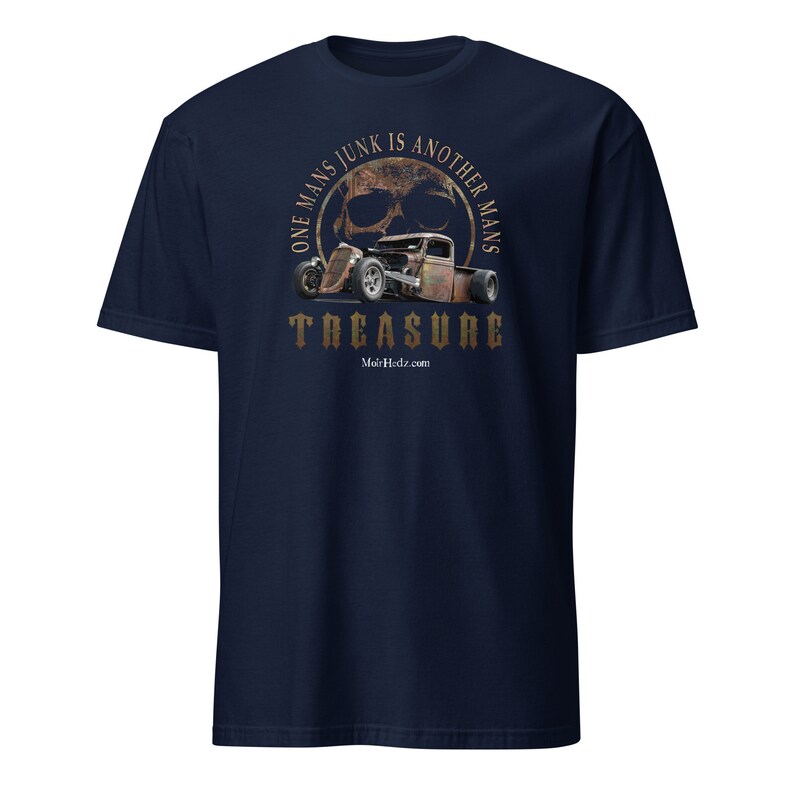 May include: A navy blue t-shirt with a distressed, rusty-colored skull and hot rod graphic. The graphic is surrounded by a circle with the text "One Man's Junk Is Another Man's Treasure" and the website "Mo'sHdz.com".