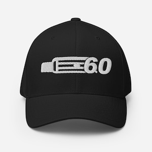 May include: Black baseball cap with a white embroidered design of a belt buckle with the text "E 6.0" on it.