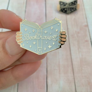 Adorable book enamel pin for introvert reading lovers! Great stocking stuffer gift for readers and for shy book addicts