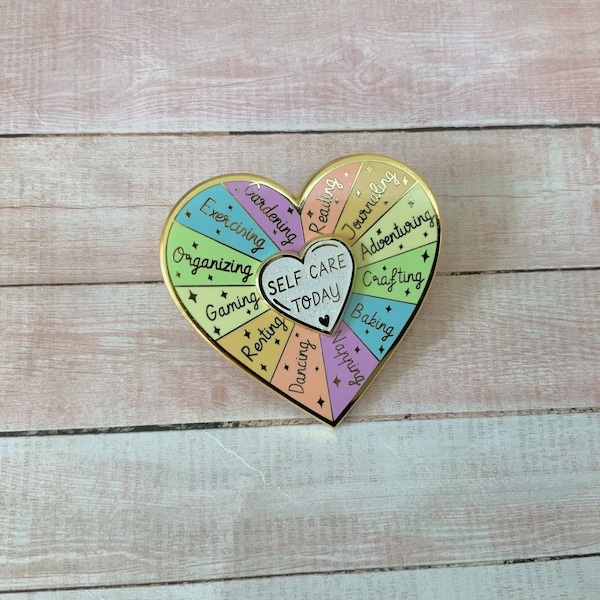 Beautiful hard Enamel spinning heart Pin with a self care message reminder, ideas for self care heart wheel interactive pin