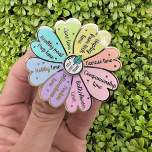 Interactieve pin met draaiend bloemenrad met ideeën voor vandaag nog voor jezelf