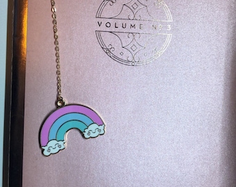 Adorable kawaii pendant metal bookmark with happy little clouds and pastel rainbow charm