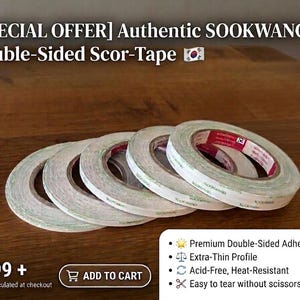 May include: Several rolls of double-sided scor-tape are displayed on a wooden surface. The tape is labeled "Authentic SOOKWANG" and features a thin profile. The image includes text highlighting the tape's premium adhesive, acid-free, and heat-resistant qualities.