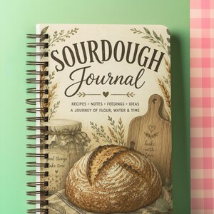 May include: A spiral-bound "Sourdough Journal" notebook with a rustic illustration of bread, a cutting board, and a jar. The cover reads "Sourdough Journal" with text below that says "Recipes, Notes, Feedings, Ideas, A Journey of Flour, Water & Time."