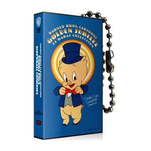 May include: A blue VHS tape featuring Porky Pig from Warner Bros. Cartoons' Golden Jubilee collection. The tape has a silver ball chain attached. The cover art includes Porky Pig in a top hat and bow tie.