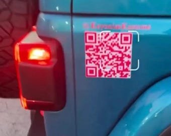 May include: A teal blue Jeep with a pink and white QR code sticker on the back. The sticker says "Krystal Kustoms" above the QR code.