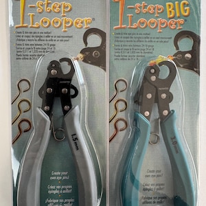 May include: Two 1-Step Looper tools in packaging. One is gray and labeled 1.5mm, the other is teal and labeled 3.0mm. Text on the packaging includes "Create & trim eye pins in one motion!" and "Create your own eye pins!"