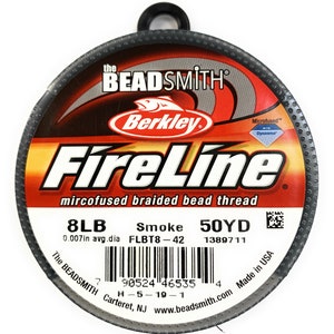 May include: A spool of "FireLine" microfused braided bead thread, 8LB, "Smoke" color, 50YD. The label includes the "Berkley" logo and "The BEADSMITH" branding. The thread is 0.007in in average diameter.