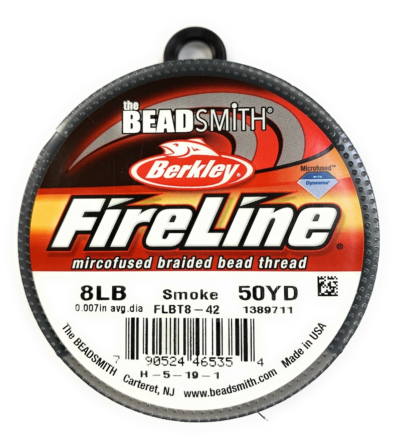 May include: A spool of "FireLine" microfused braided bead thread, 8LB, "Smoke" color, 50YD. The label includes the "Berkley" logo and "The BEADSMITH" branding. The thread is 0.007in in average diameter.