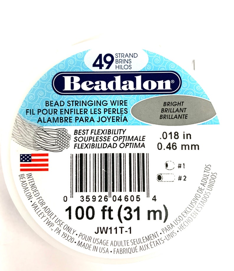 May include: A white spool of Beadalon bead stringing wire. The label includes text in English, French, and Spanish, with measurements of .018 inches and 100 feet (31 m). The product is intended for adult use.