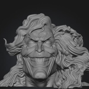 May include: A grayscale sculpture of a character's head with exaggerated features. The face has a wide, unsettling grin, furrowed brow, and long, wavy hair. The sculpture is detailed and appears to be a bust.