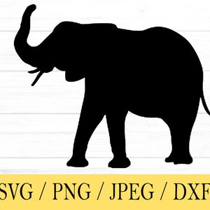 May include: Black silhouette of an elephant with its trunk raised in the air. The elephant is standing on a white wooden background.