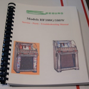 Manual da Jukebox Seeburg HF100G e 100W. Manual de serviço, manual de peças, manual de solução de problemas.