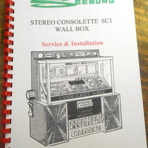 May include: A printed manual for a Seeburg Stereo Consolette SC1 Wall Box, featuring a detailed black and white illustration of the device. The cover includes the text "Service & Installation" and the Seeburg logo in green.