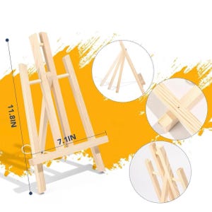 May include: A small, natural wood easel, 11.8 inches tall and 7.1 inches wide, designed to hold artwork. The easel has a three-legged design for stability and a horizontal support bar. Ideal for displaying paintings, photos, or other artwork.