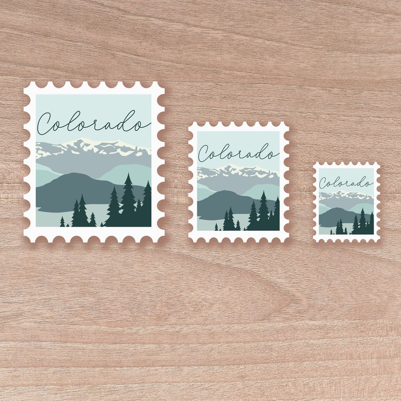 May include: Three postage stamp-style stickers with a Colorado landscape design. The stickers feature a mountain range, trees, and the word "Colorado" in a script font. The color palette includes shades of blue, green, and white.