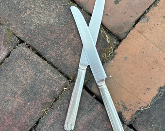 VINTAGE set of 2 matching butter knife knives stainless steel silver tone all metal acanthus light patina mid century classic subtle