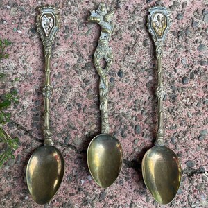 VINTAGE set of 3 souvenir spoons gold tone metal demitasse small ornate mythological creature heraldry Fleur de lis Griffin Lion Italy