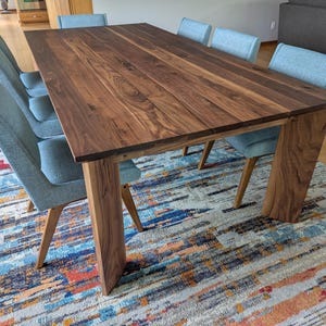 The Valencourt.  A contemporary dining table with mid century modern inspiration