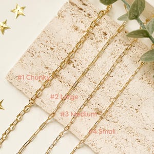 May include: Four gold-toned metal chains of varying link sizes arranged side by side. The chains are labelled #1 Chunky, #2 Large, #3 Medium, and #4 Small, featuring elongated oval links that decrease in thickness and width from left to right.
