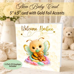 May include: A baby shower card with gold foil accents. The card features a cute cartoon bee holding a teddy bear and a pacifier. The text "Welcome Babee" is written in gold. The card measures 5" x 5" and includes a 5.25" x 5.25" envelope.