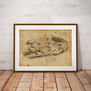 May include: A vintage-style blueprint of the Millennium Falcon spaceship from Star Wars. The drawing is in black and white on a beige background and is framed in a brown frame.