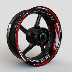 May include: Black motorcycle wheel rim with a red and white graphic design that says "Joker" on the side.