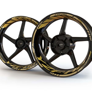 May include: Two black motorcycle wheels with gold YZF-R6 decals. The decals have a black and gold striped design.