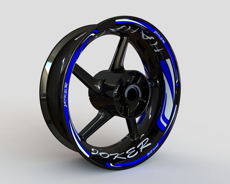 May include: A black motorcycle wheel rim with a blue and white graphic decal that says "JOKER" on it.