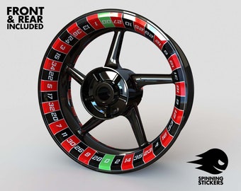 May include: A black motorcycle wheel with a red and black roulette wheel design. The numbers 1 to 36 are printed on the wheel. The text "FRONT & REAR INCLUDED" is printed at the top of the image.