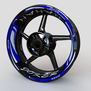 May include: Blue and white motorcycle wheel rim decals with the word "JOKER" repeated around the rim.