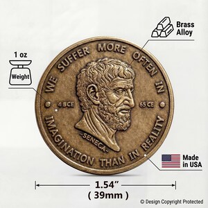 May include: A round brass alloy coin featuring a relief portrait of Seneca with the text WE SUFFER MORE OFTEN IN IMAGINATION THAN IN REALITY, 4 BCE, 65 CE, and SENECA. The coin has a weight of 1 oz and a diameter of 1.54 inches, made in USA.
