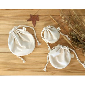 Sacs cadeaux de mariage, pochettes de mariage en coton, sacs de mariage beiges naturels, sacs de baptême, pochette ronde à cordon, pochette de mariage naturelle