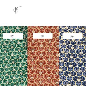 May include: Three fabric swatches with geometric patterns. The swatches are green, red, and blue, each with a repeating fan-like design within a hexagonal grid. Each swatch is labeled with a white rectangle containing the letters "F" and a number.