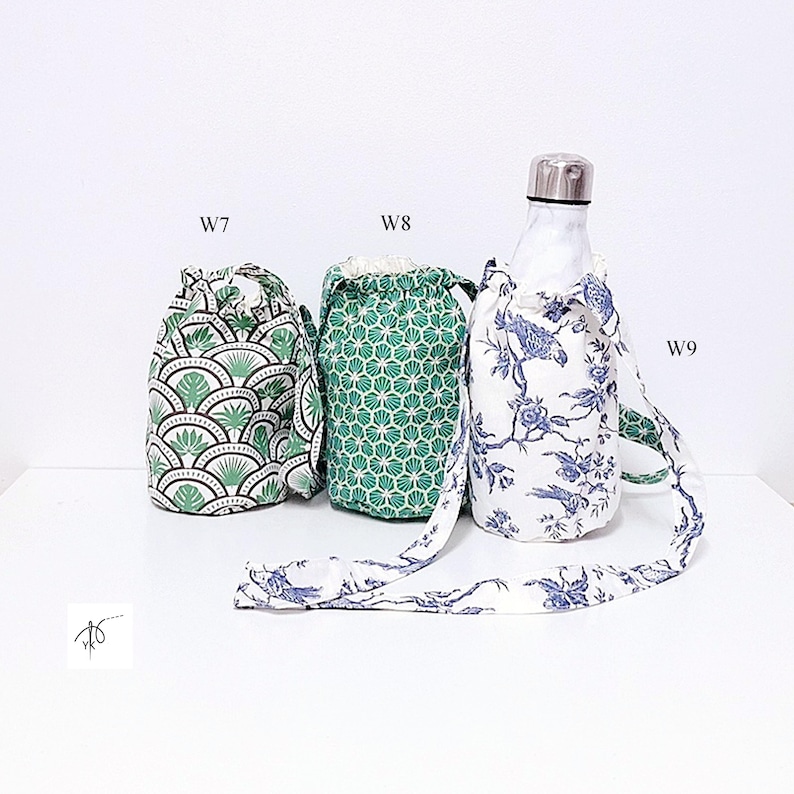 May include: Three fabric water bottle holders with drawstring closures. One features a green and white fan leaf pattern, another has a green geometric design, and the third has a blue floral print. The bottle holder with the floral print has a matching strap.