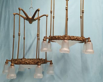 Early 20th century pair of large brass hall lights with glass shades