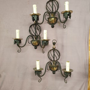 Three early 20th century steel wall lights