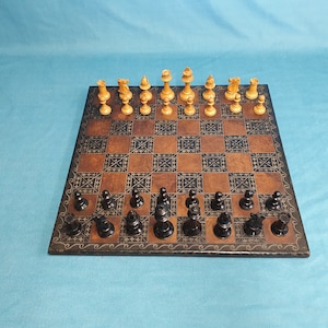 Turn of the century chess set with leather board