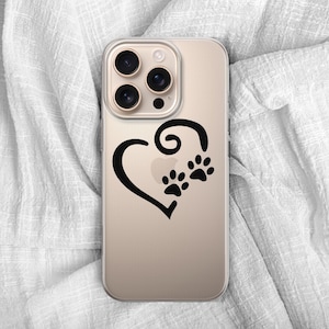 May include: A gold-colored phone case featuring a black heart design with two paw prints. The case has a clear, protective design and is likely made of durable material. The phone case is a pet-themed accessory.