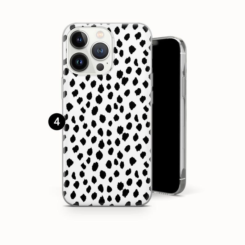 May include: A clear phone case with a black and white dalmatian spot pattern. The case is shown with a black smartphone. The phone case has a camera cutout and button covers.