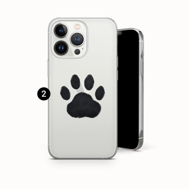 May include: Clear phone case with a black paw print design. The case is shown with a black smartphone. The paw print is centered on the back of the case.