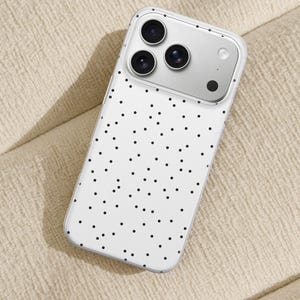 May include: A white phone case with a black polka dot pattern. The case has a clear border and a silver camera module with three lenses. The phone case is designed to fit a smartphone.