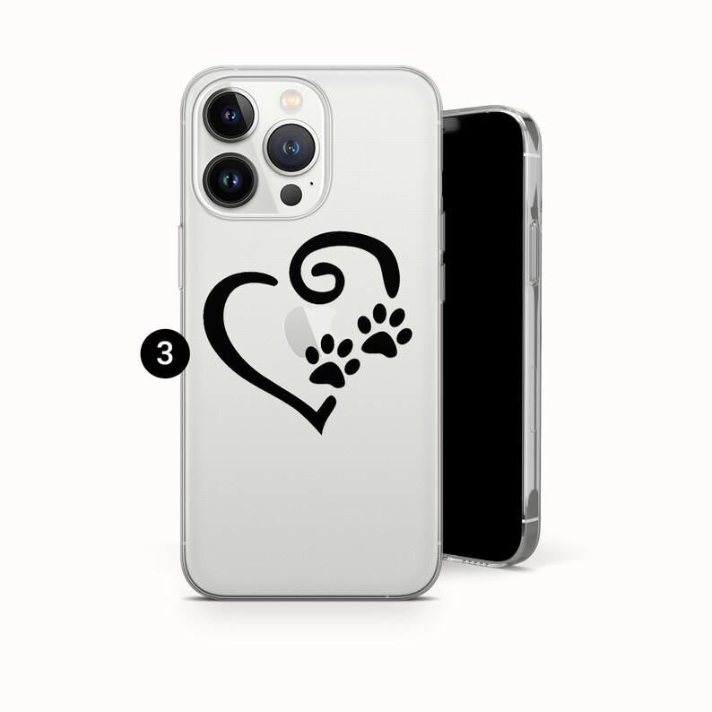 May include: Clear phone case featuring a black heart design with paw prints. The case is made of a transparent material, allowing the phone's color to show through. The design is simple and elegant.