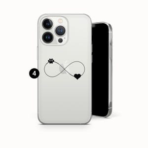 May include: Clear phone case with a black paw print, infinity symbol, and heart design. The case is shown with a black phone next to it. The phone case is designed to protect the phone from scratches and damage.