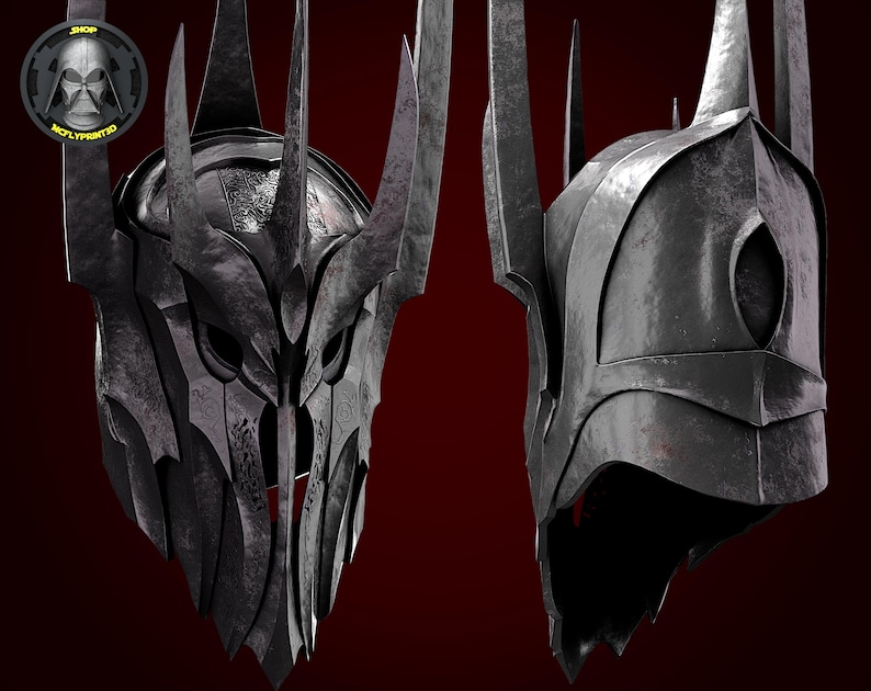 Puede incluir: Un casco de metal negro con una corona de p&uacute;as. El casco tiene una m&aacute;scara facial con agujeros para los ojos y una barbilla puntiaguda.