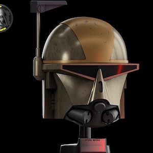 May include: A weathered, bronze-coloured helmet with a gold and black design. The helmet has a red visor and a black antenna. The helmet is labelled "STAR WARS RAKO HARDEEN".