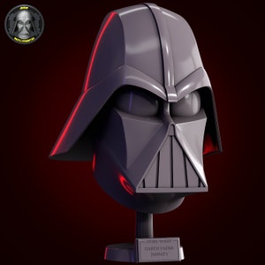 Peut inclure: Un buste gris de Dark Vador avec une lueur rouge autour des bords. Le buste est sur un socle noir avec une plaque argentée qui indique "STAR WARS - DARTH VADER - INFINITY".