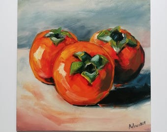 May include: A still life painting of three orange persimmons with green leaves on a white surface. The persimmons are arranged in a triangular shape, with the largest one in the center. The painting is done in a loose, impressionistic style, with visible brushstrokes.